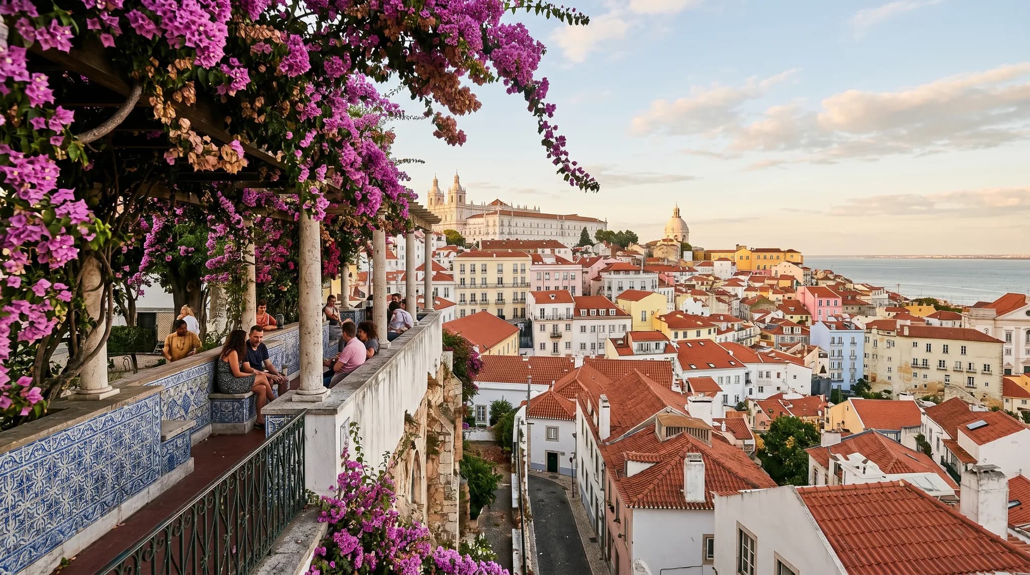 Romantic terrace of Miradouro de Santa Luzia with bougainvillea-covered pergola and Alfama views